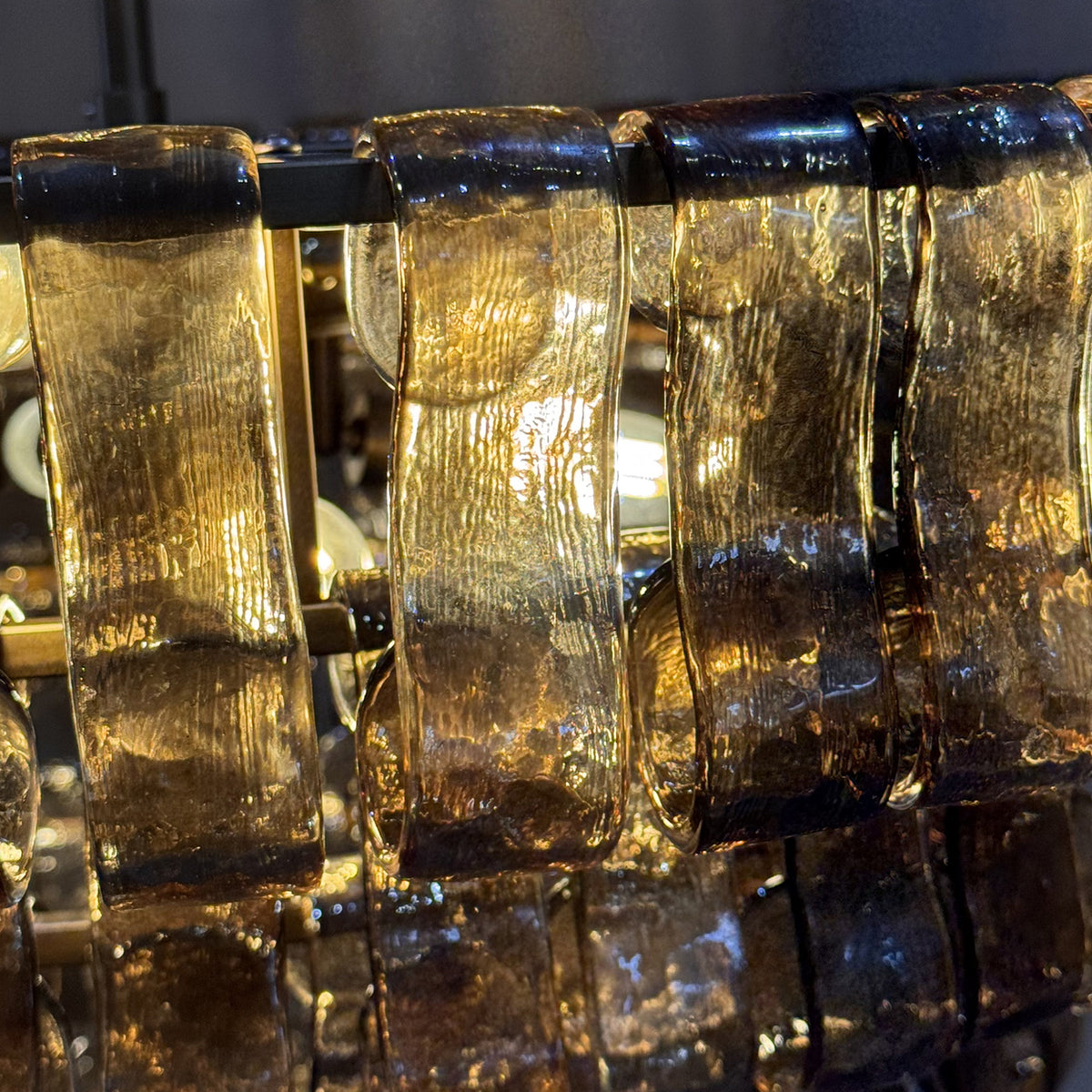 Close-up of textured curved smoke glass panels