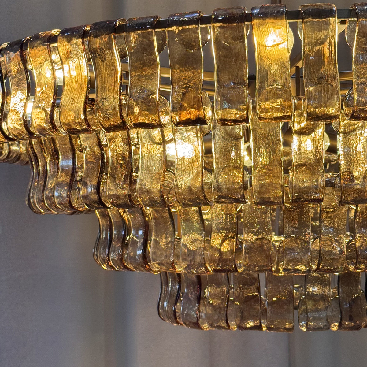 Close-up of the chandelier cascading glass tiers