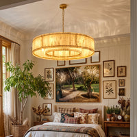 Alabaster drum chandelier above a bed, full fixture with canopy