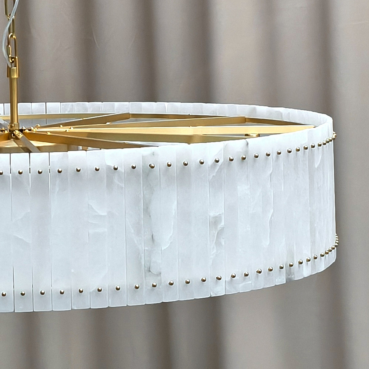 Copper support frame and alabaster shade, unlit close-up detail