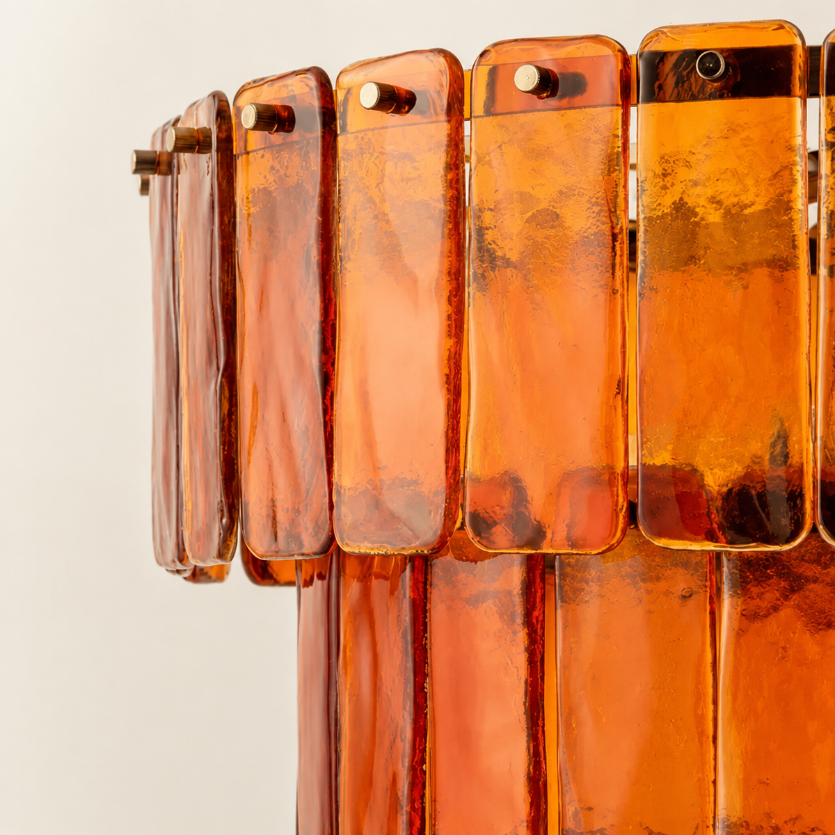 Textured amber glass and gold-tone fittings close-up